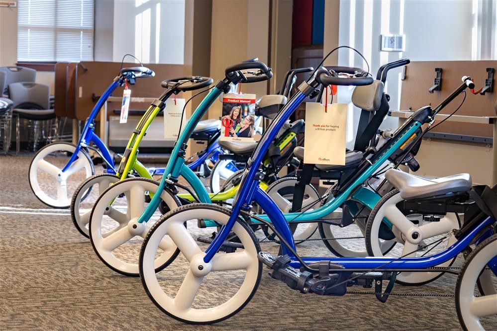  Four adaptive bicycles are lined up in a row.